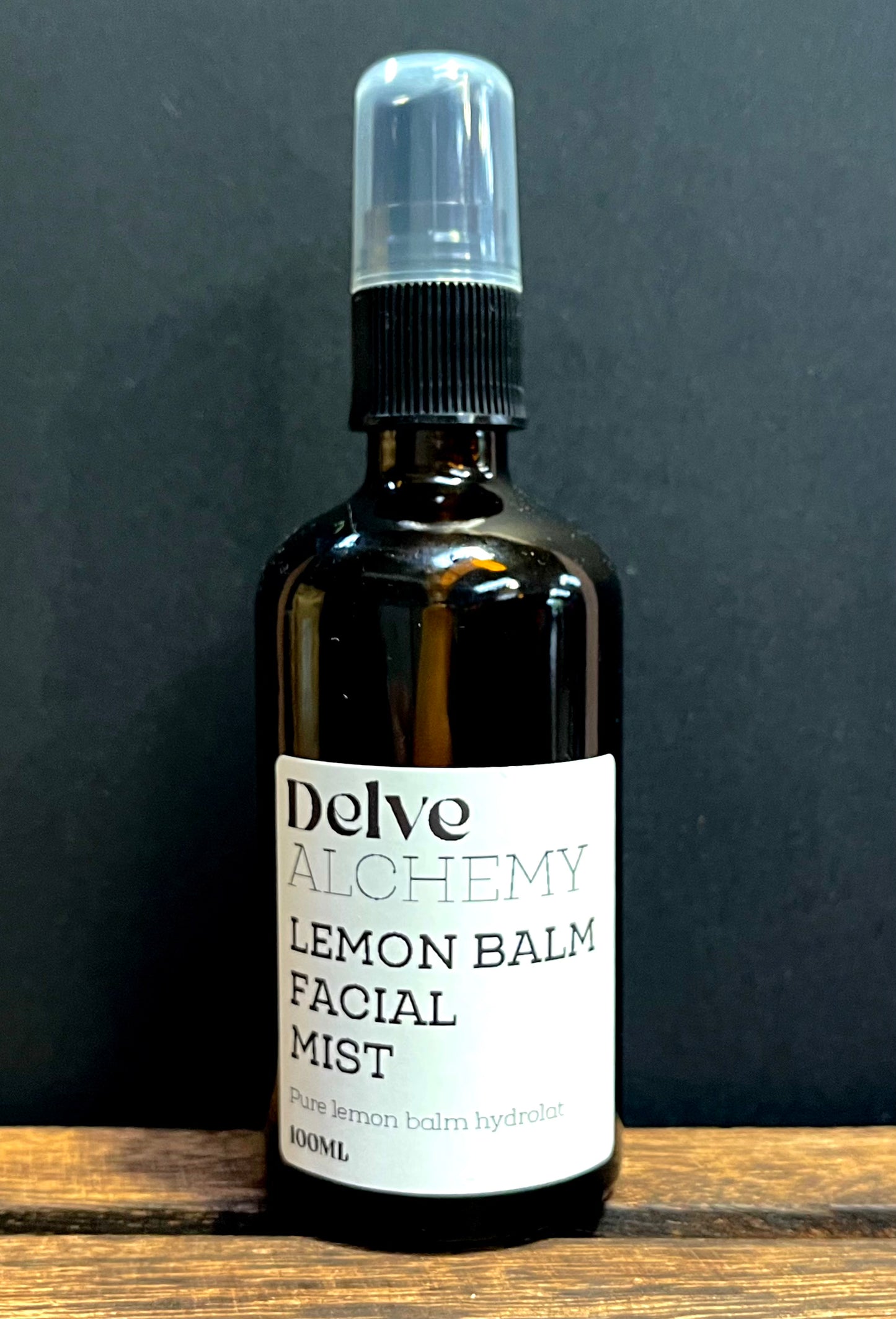 Delve Alchemy Natural Lemon Balm Facial Mist in amber glass spray bottle with black pump