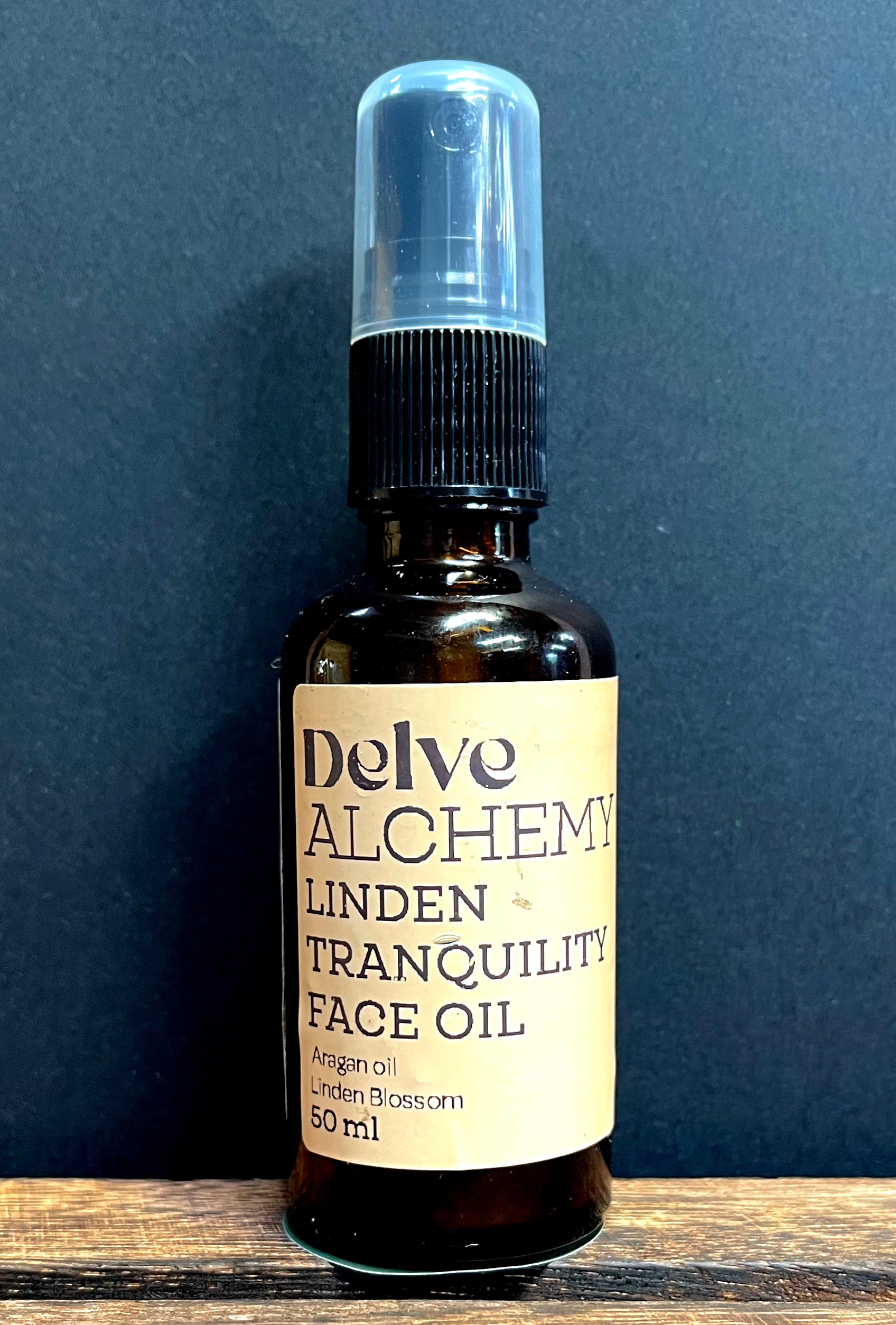 Linden and Argan Face and Hair Oil by Delve Alchemy in an amber glass pump bottle 