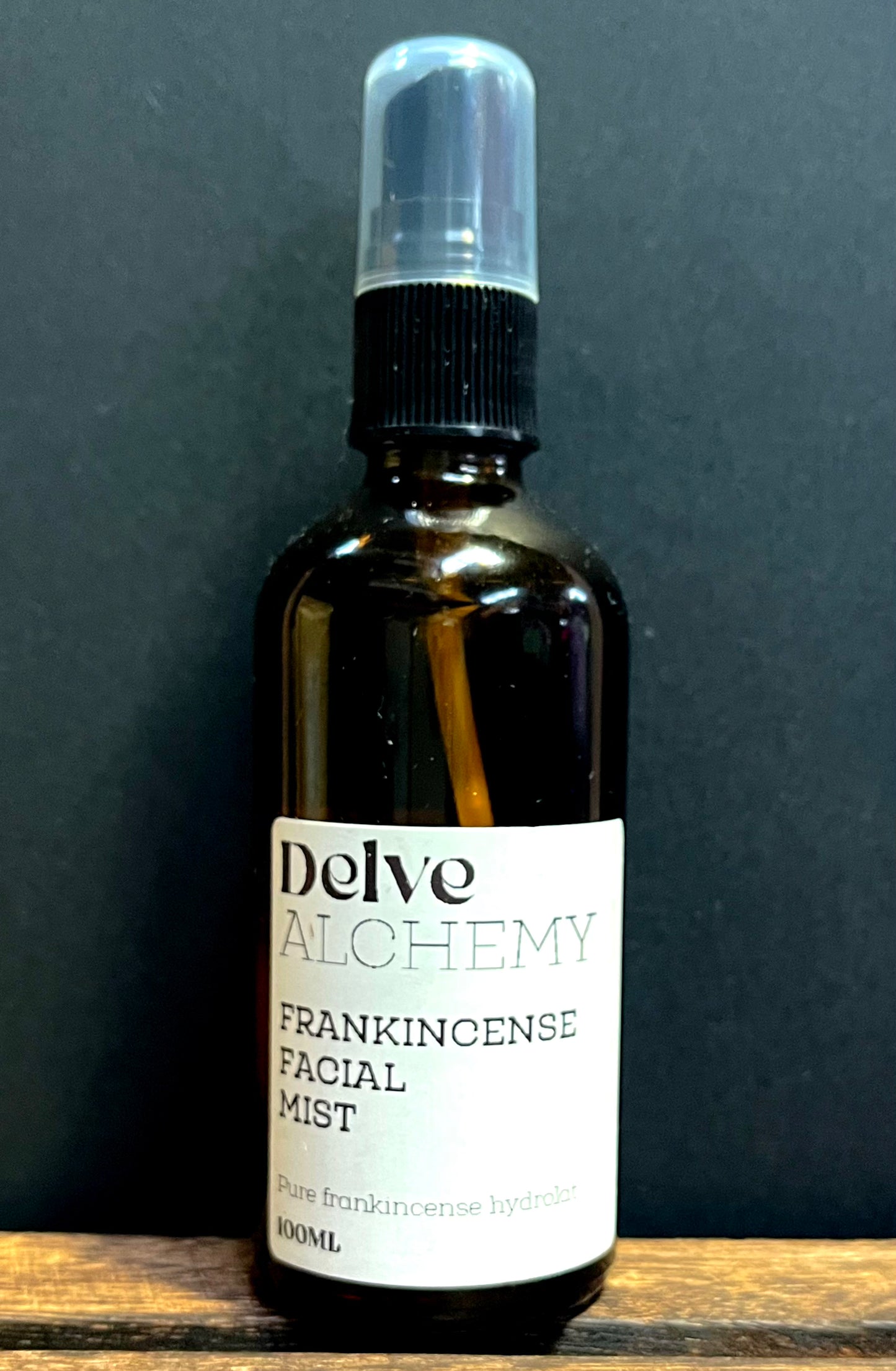 Delve Alchemy Natural Frankincense Facial Mist in amber glass spray bottle with black pump